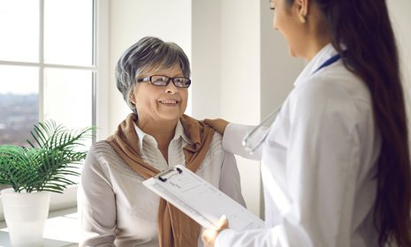 Clinician speaking with patient during consultation